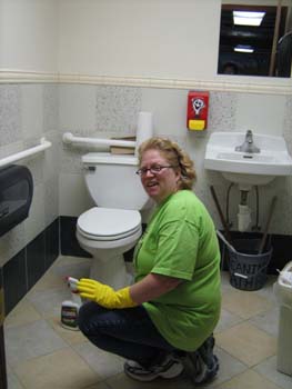 Lisa cleaning bathroom